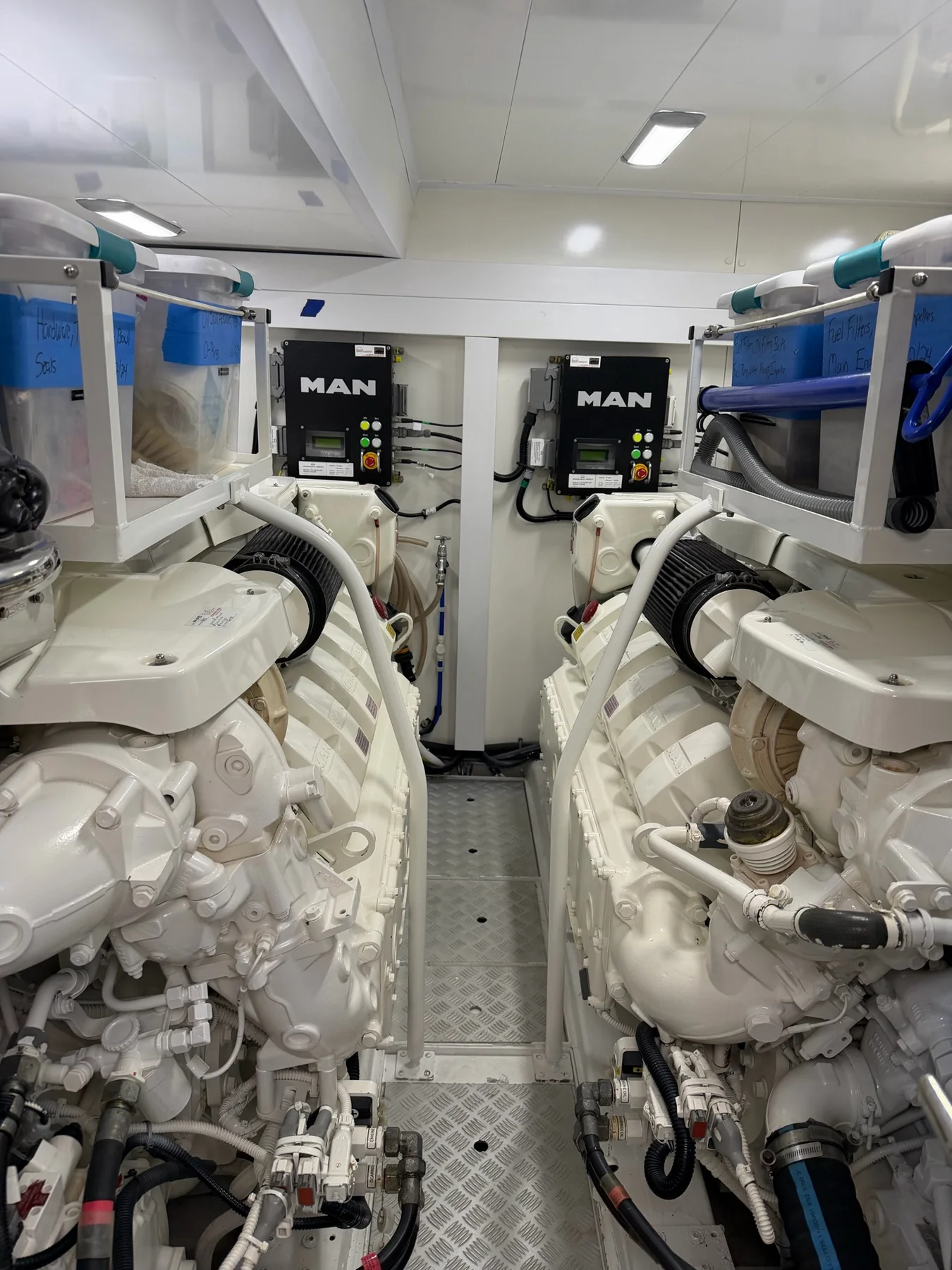 Twin MAN marine diesel engines installed in a clean engine room