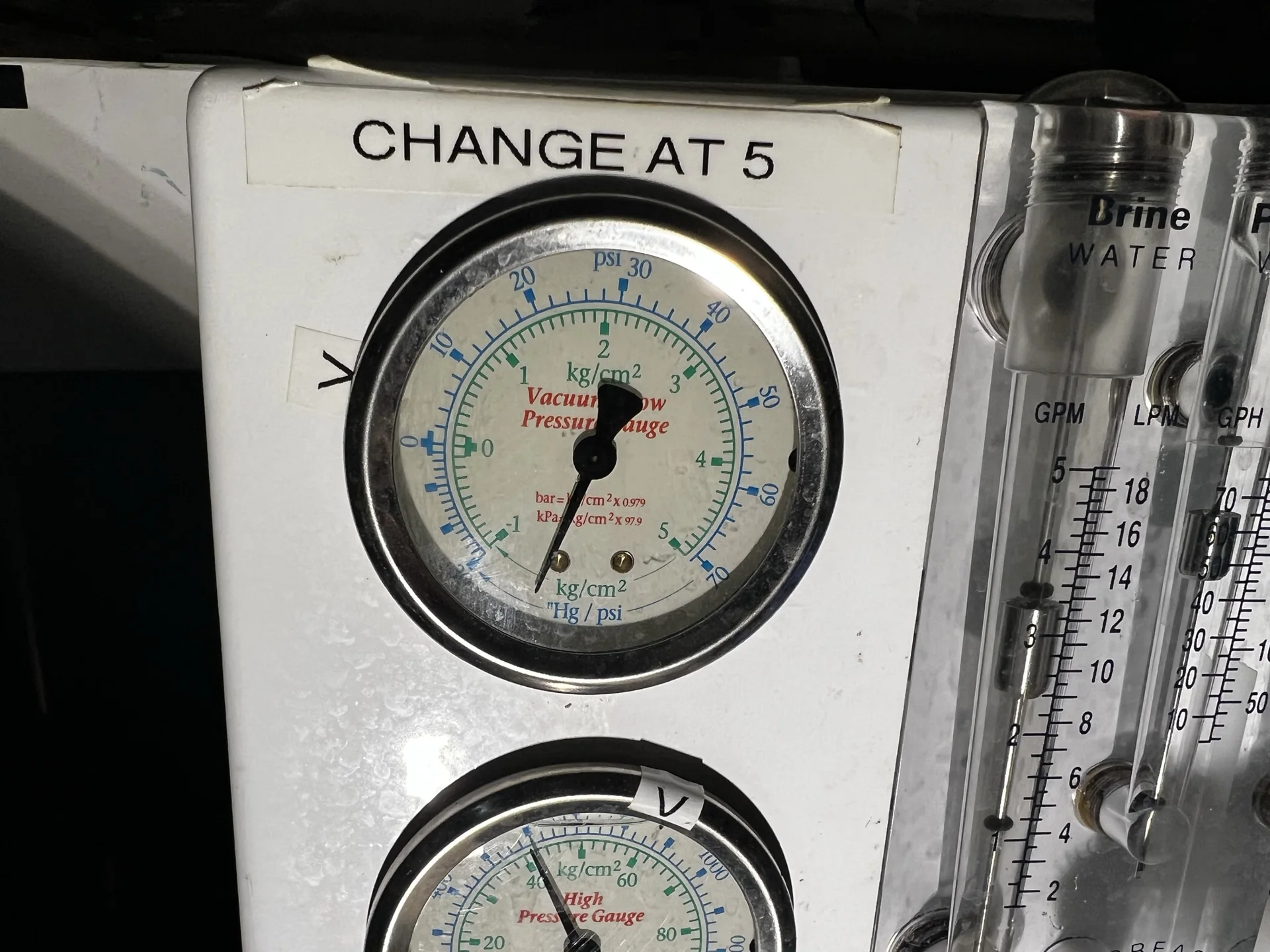 Marine watermaker control panel with pressure gauges and flow meters